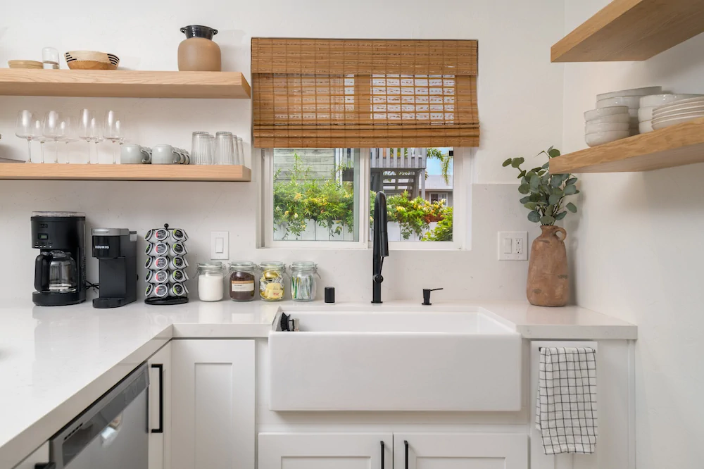 Modern San Diego Airbnb kitchen with open shelving and cost-effective design.