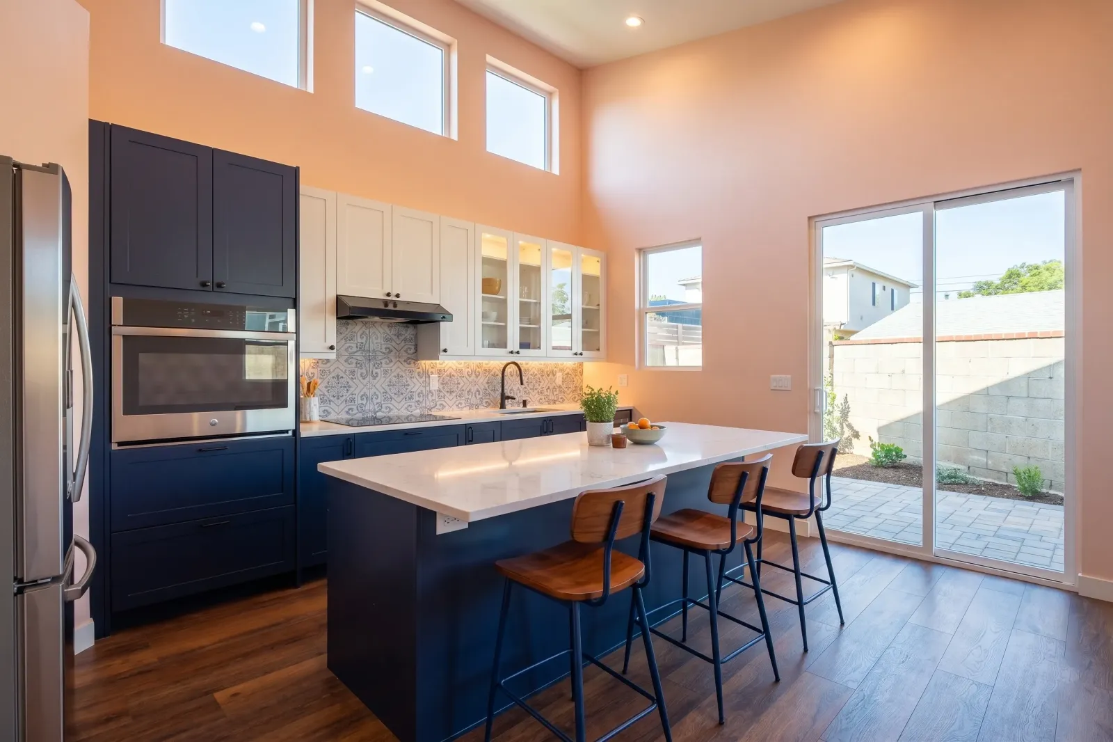 Blue kitchen with pink accent walls