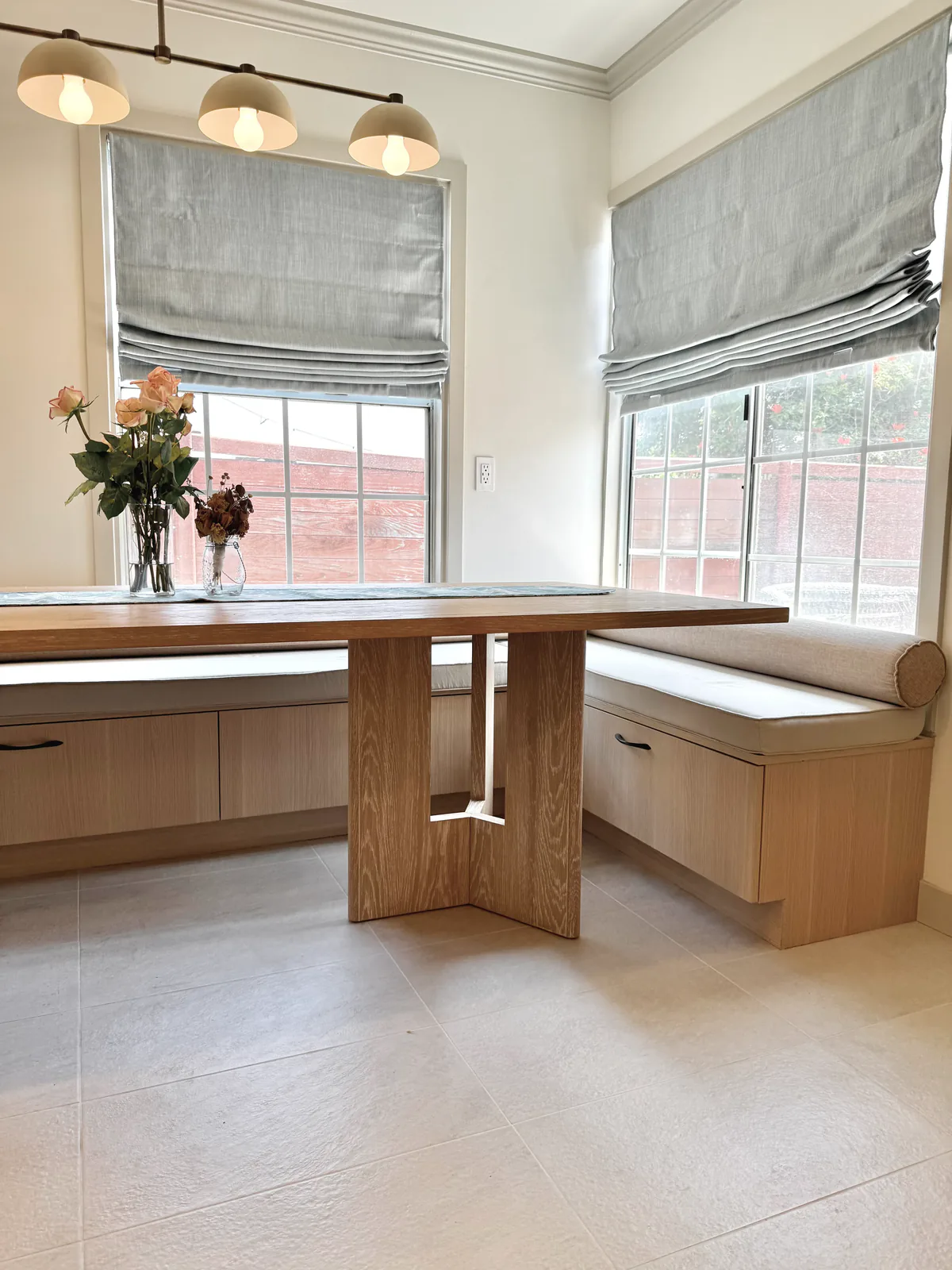 Breakfast nook with built-in banquette and white-oak table