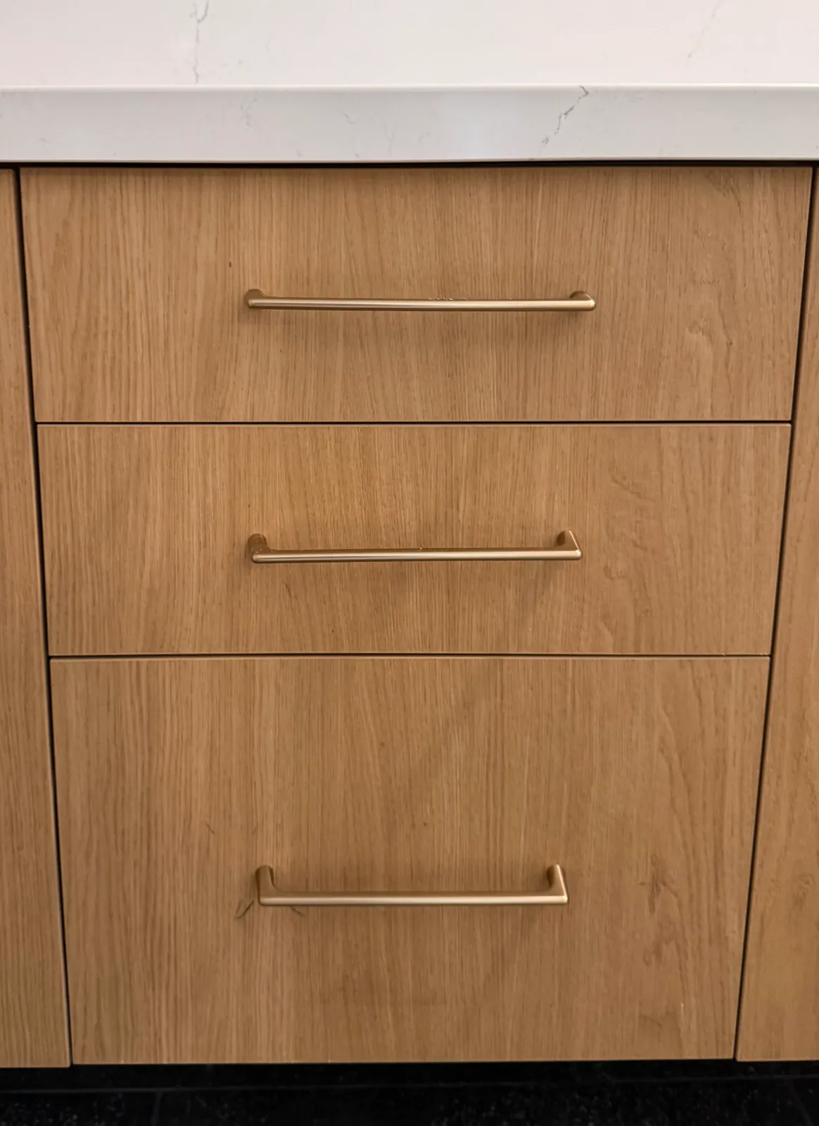 White-oak drawer stack with brass pulls