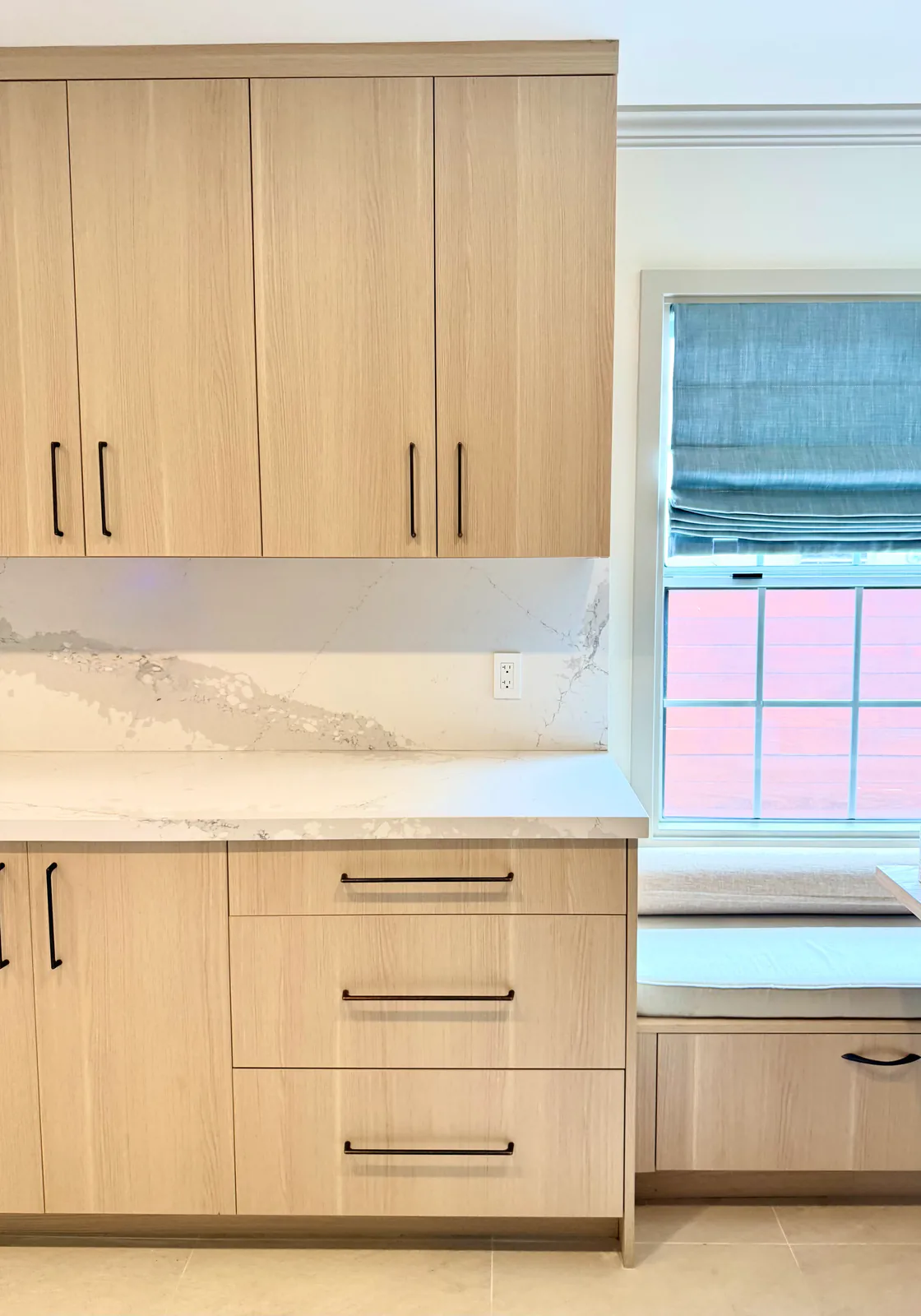 Cabinetry meeting the built-in window bench